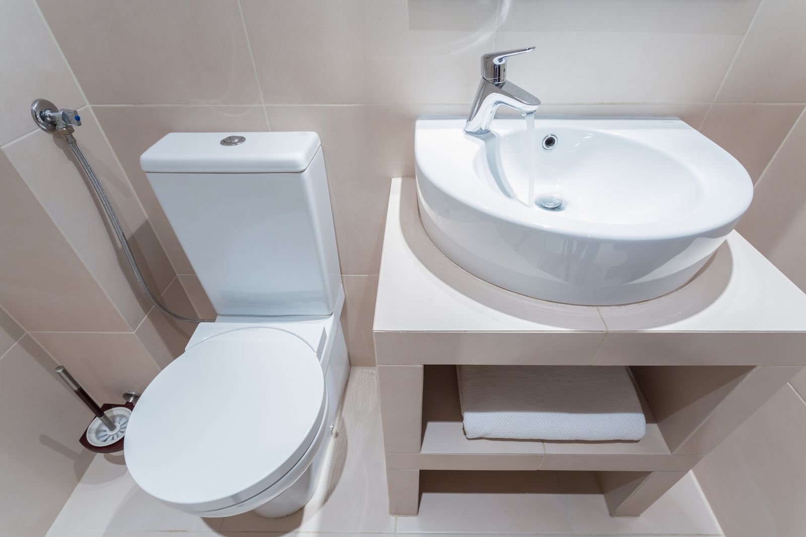 Clean bathroom toilet and basin after a repair